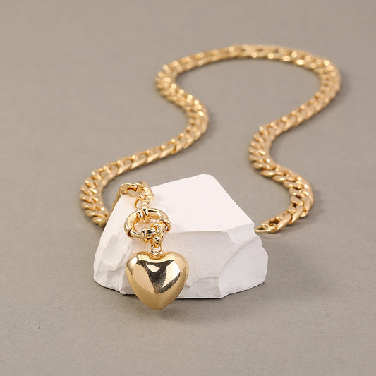 Power and Grace: Contrasting Link Necklace with Heart Charm